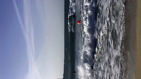 A guy rides the waves, a man trains to surf Stock Footage 238686571