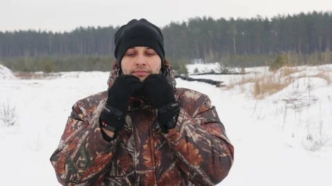 The guy is riding an ATV on a snow-covered road in winter Stock Footage 84955176