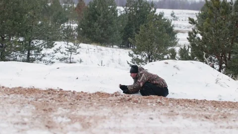 The guy is riding an ATV on a snow-covered road in winter Stock Footage 84958395