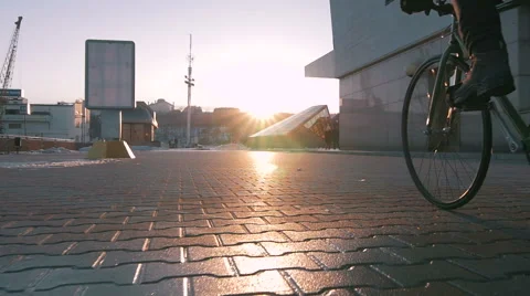 Guy riding fixed gear bike in marine station, slow motion Stock Footage