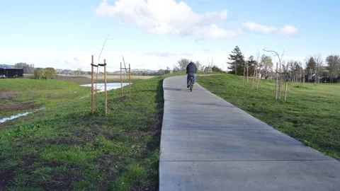 Guy Riding His Bicycle Stock Footage 236970474