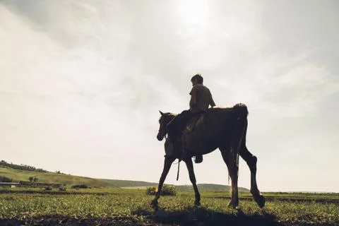 Guy riding horseback Stock Photos