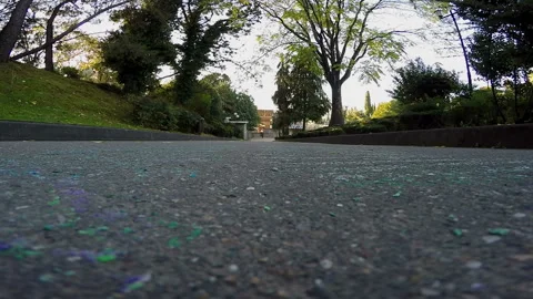 Guy is riding pass the camera on the skateboard Video stock 93821409