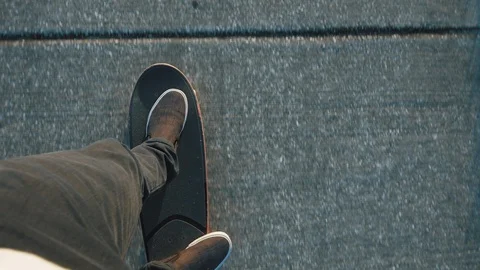 Guy Riding Skateboard Point of View - Slow Motion Stock Footage 87672764