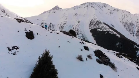 The guy is riding a snowboard. In the mountains in pristine snow. Stock Footage 101969948