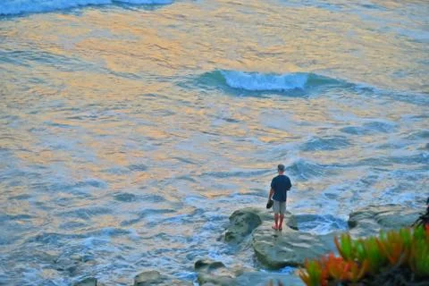 Guy on a rock Stock Photos