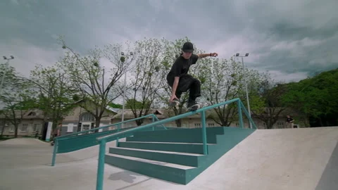 The guy on roller skates in the skatepark does tricks. Stock Footage 199838990