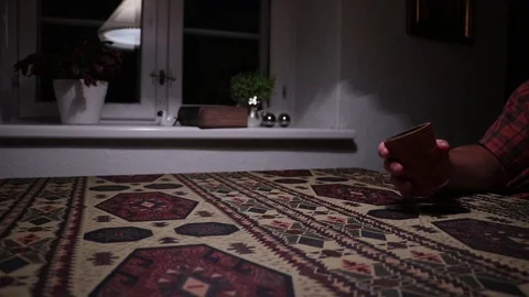 Guy rolling dices with a dice cup. Stock Footage 113596119