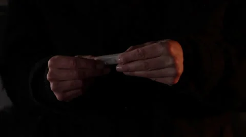 The guy rolling joint of marijuana, close up shot Stock Footage 34330362