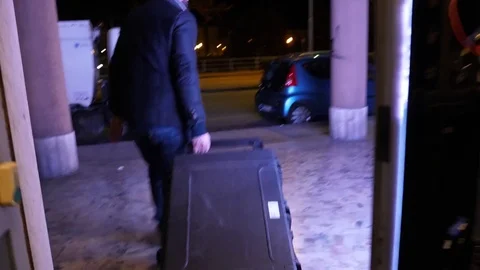 Guy with a rolling plastic military case  Video stock 85441900