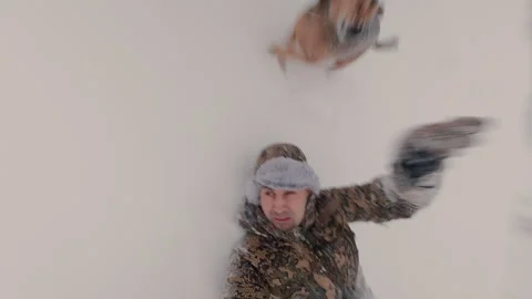 A guy rolls down a slide in the snow in winter. Stock Footage 327716959