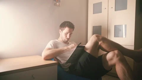 The guy in the room is reading a book1 Stock Footage 140050691