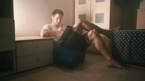 The guy in the room is reading a book2 Stock-Footage 140050739