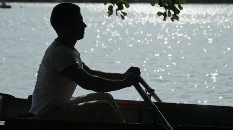 The guy Rowing the Oars on the River Stock Footage 68084537