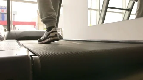 The guy is running along the treadmill Stock Footage 73988995