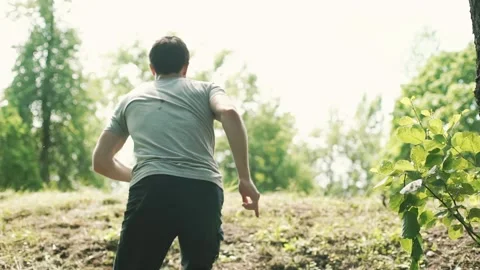 The guy is running up the hill Stock Footage 139590364