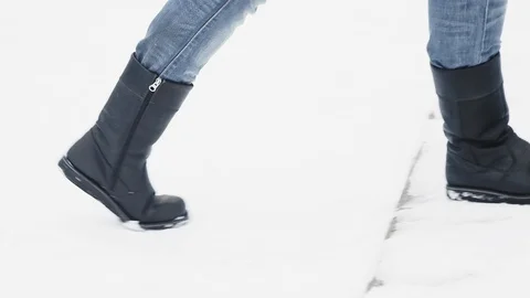 A guy is running up the snowy stairs Stock Footage 121666007
