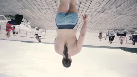 Guy with a running start jumping into the lake Stock Footage 80518054