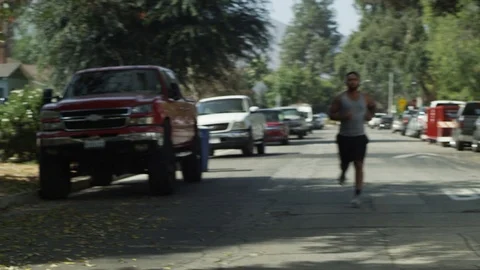 Guy Running on Street Stock Footage 125963907