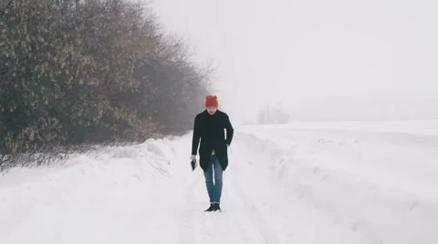 The guy running through the snow. Slow motion Video stock 61237541