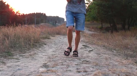 The guy running through the woods at sunset Stock Footage 57258065