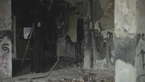 Guy runs away from danger, grim reaper comes after him from darkness, horror. Stock Footage 92586887