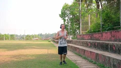 The guy runs lightly around the stadium, slow motion video. Video stock 231337126