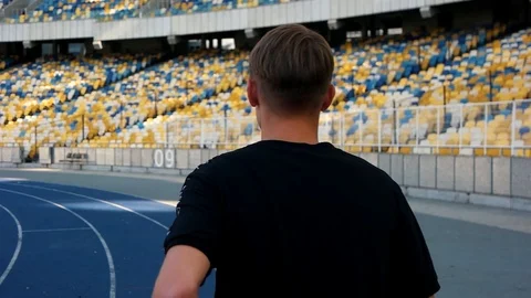 Guy runs in the stadium Stock Footage 118578936