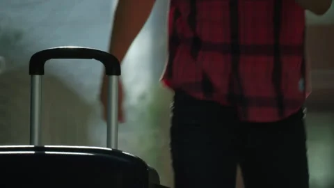 The guy runs up, takes the suitcase and leaves. Time to move, travel. Stock Footage 194043261