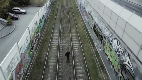 The guy is scared by a tram on tram tracks Stock Footage 162037887