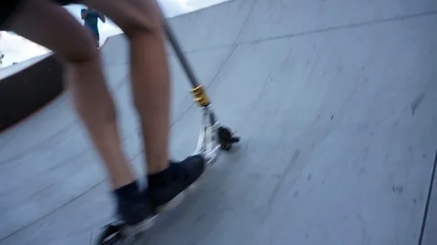 Guy on the scooter jumps on the springboard 스톡 동영상 102248928