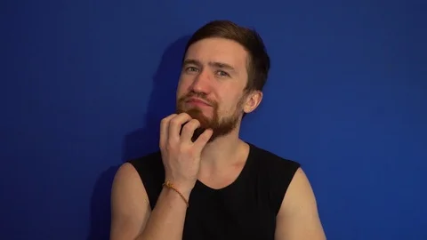 The guy scratching his beard Stock Footage 124460985
