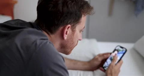 Guy Scrolling on Social Media. guy casually scrolling through social media Stock Footage 277969539