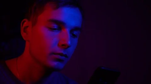 The guy scrolls social networks in his smartphone, closeup Stock Footage 122237317