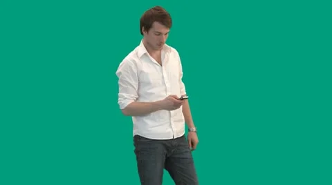 Guy sending text messages from mobile phone - green screen - pre keyed - MINT.GS Stock-Footage 8665684