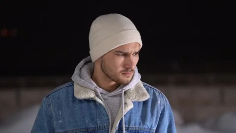 A guy with a serious face looking at the camera. Winter Stockbeeldmateriaal 147071212