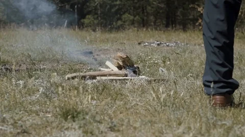 Guy setting a bonfire Stock Footage 122318622