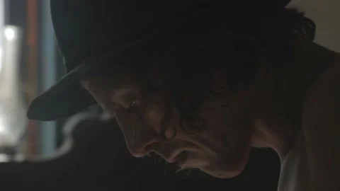 The guy sews up his pants manually Stock Footage 120906087