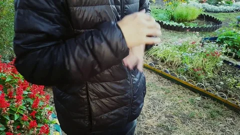 Guy shakes the jacket off the dust Video stock 80427248