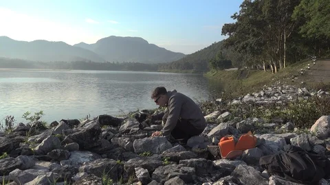 A guy shoot time lapse in Chiang Mai, Thailand Stock Footage 100899012