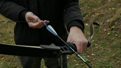 A guy shoots a bow 스톡 동영상 220906363