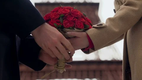 Guy showing his affection to girlfriend, presenting woman with bouquet of roses Stock Footage 83905672