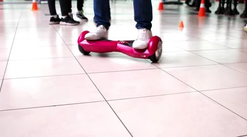 The guy shows to ride Hoverboard Stockbeeldmateriaal 67564535