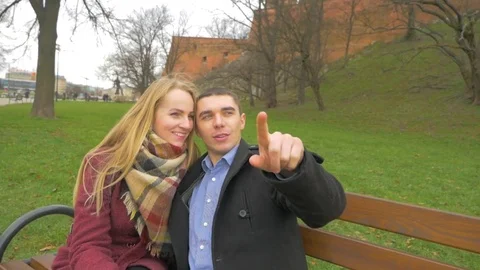 The guy shows something to the girl Stock Footage 85445192