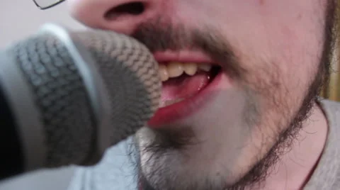 Guy singing into a microphone Stock Footage 51312917