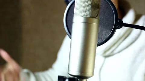 The guy singing in the Studio Video stock 59873399