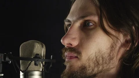 The guy sings in the Studio Stock Footage 100966778