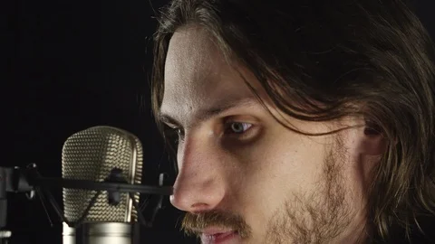 The guy sings in the Studio Stock Footage 101222801