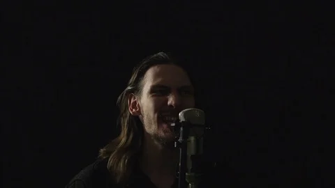 The guy sings in the Studio Video stock 101319097