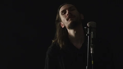 The guy sings in the Studio Stock Footage 103838546